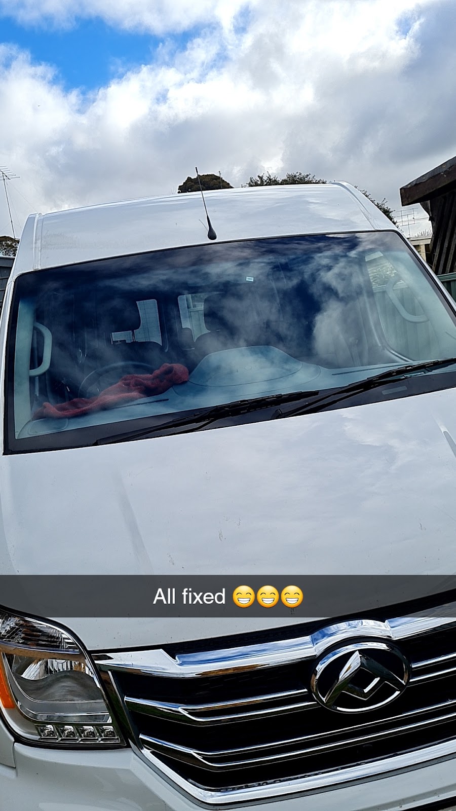 A white Mercedes van with a newly fitted windscreen